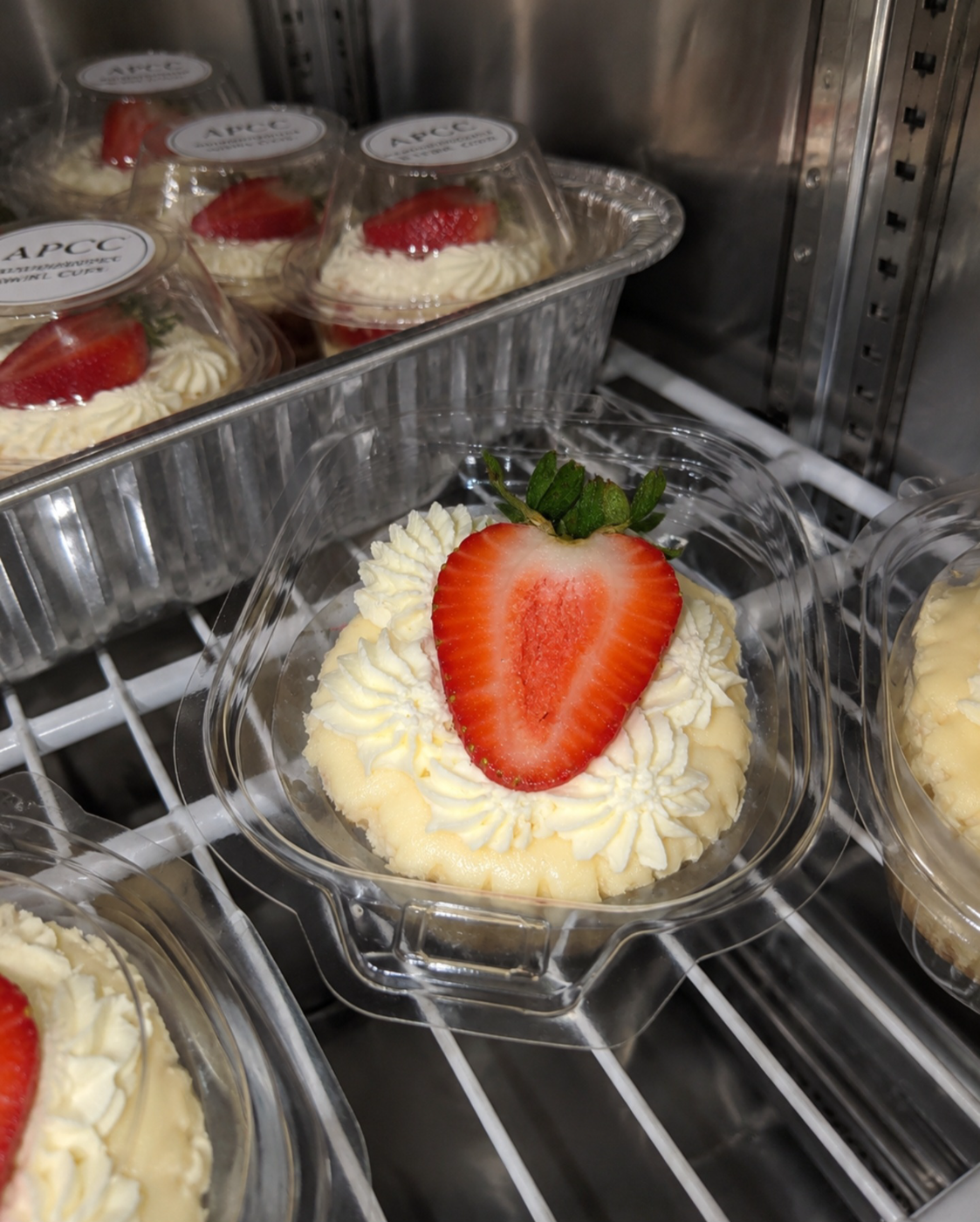 APCC swirl cup topped with our signature fresh strawberry, in the case