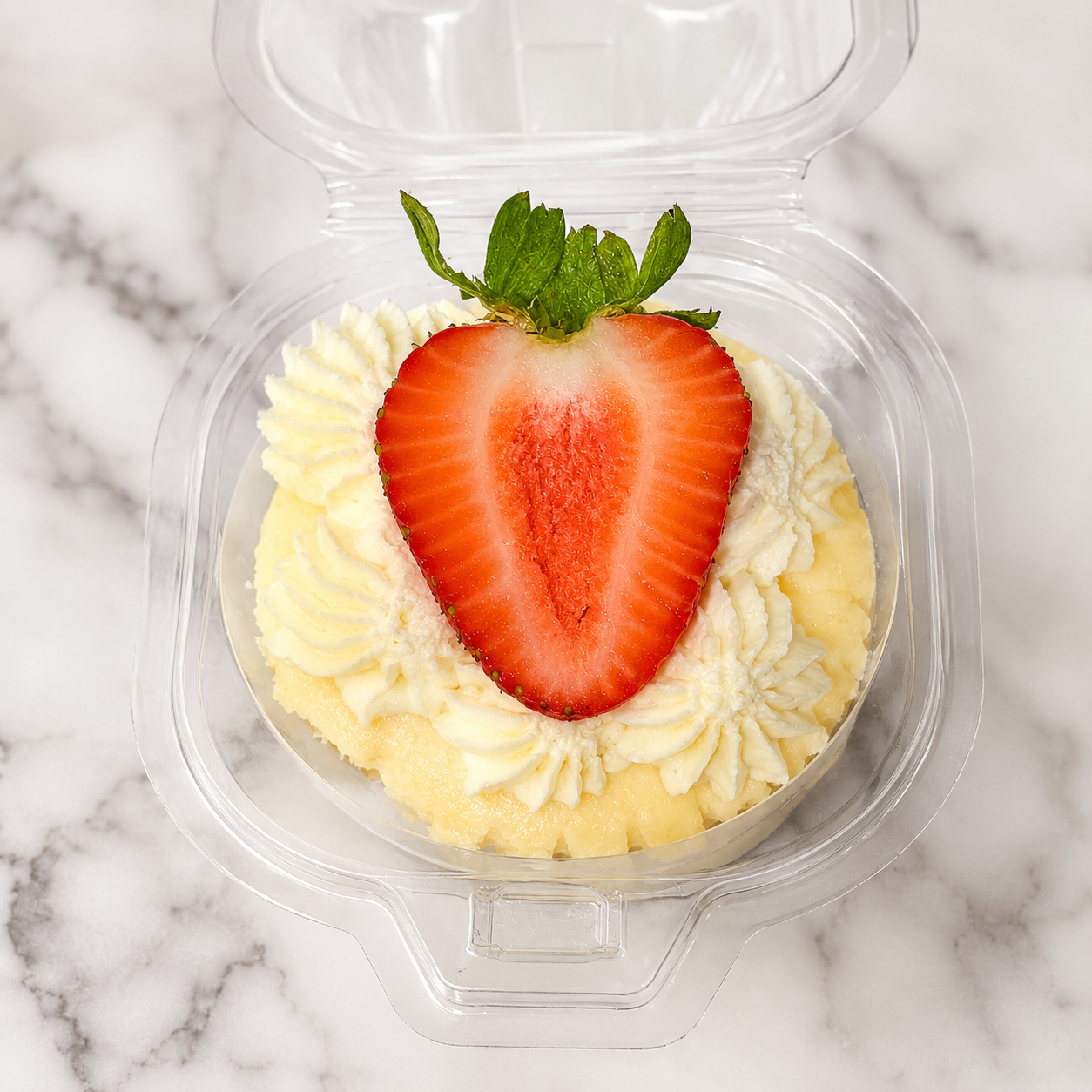 Overhead of a swirl cup topped with our signature halved strawberry